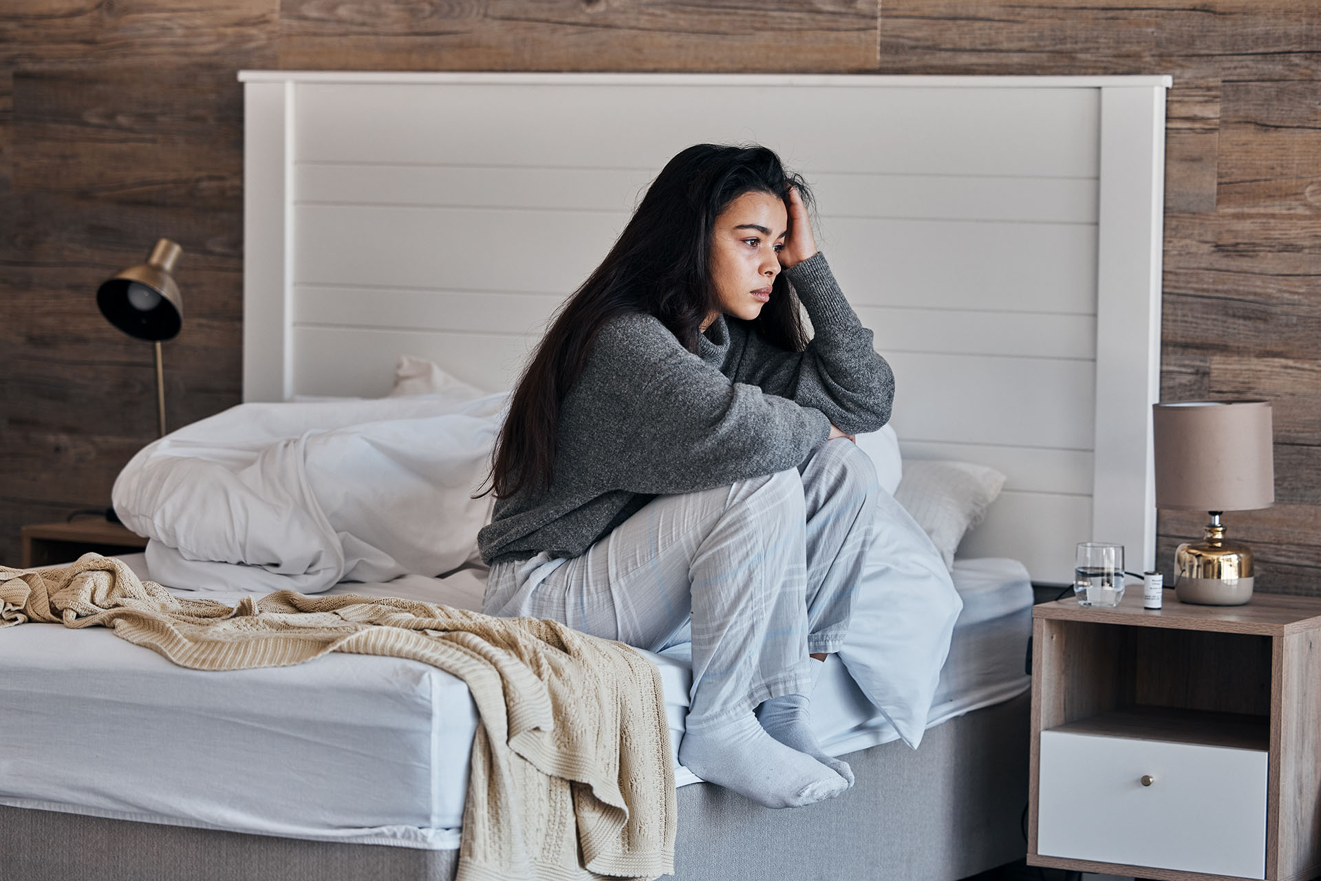 Depressed, stress and tired woman on her bed