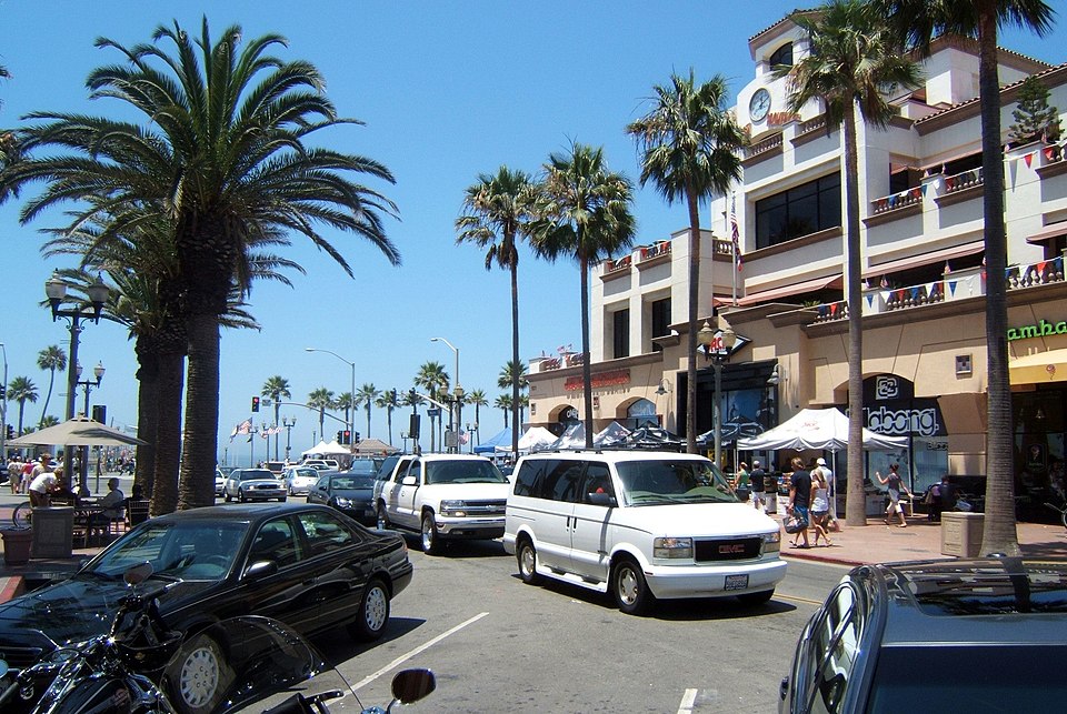 Huntington Beach downtown street lined with palm trees near the coast, representing outpatient addiction treatment services at Breakaway Health near Huntington Beach, California.