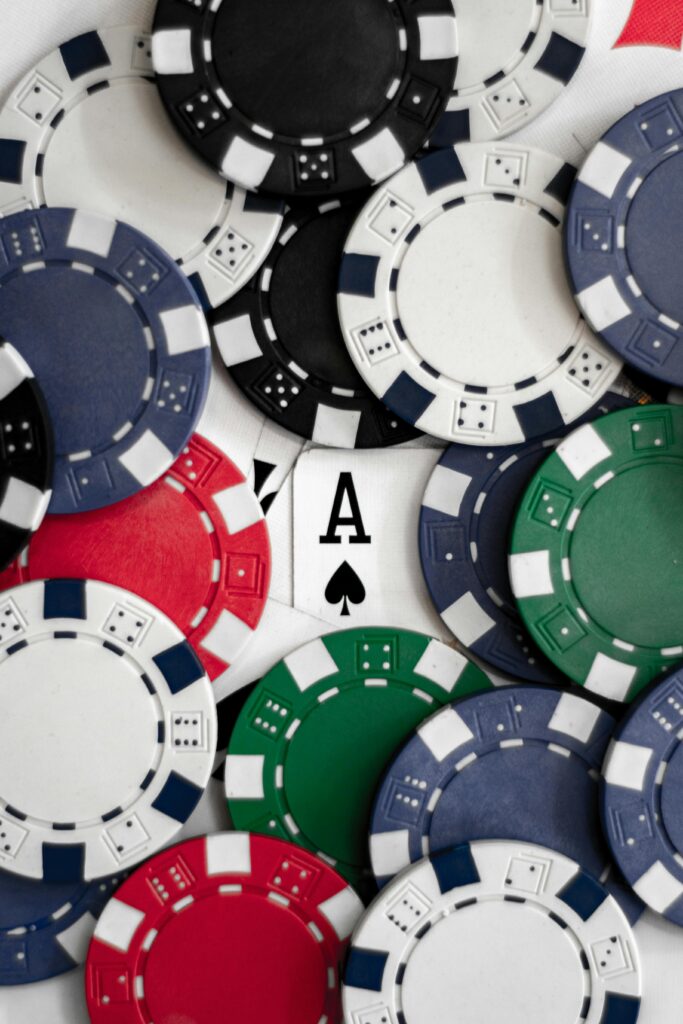 Close up of poker chips and an Ace card representing the need for gambling addiction treatment at Breakaway Health in Costa Mesa, California.