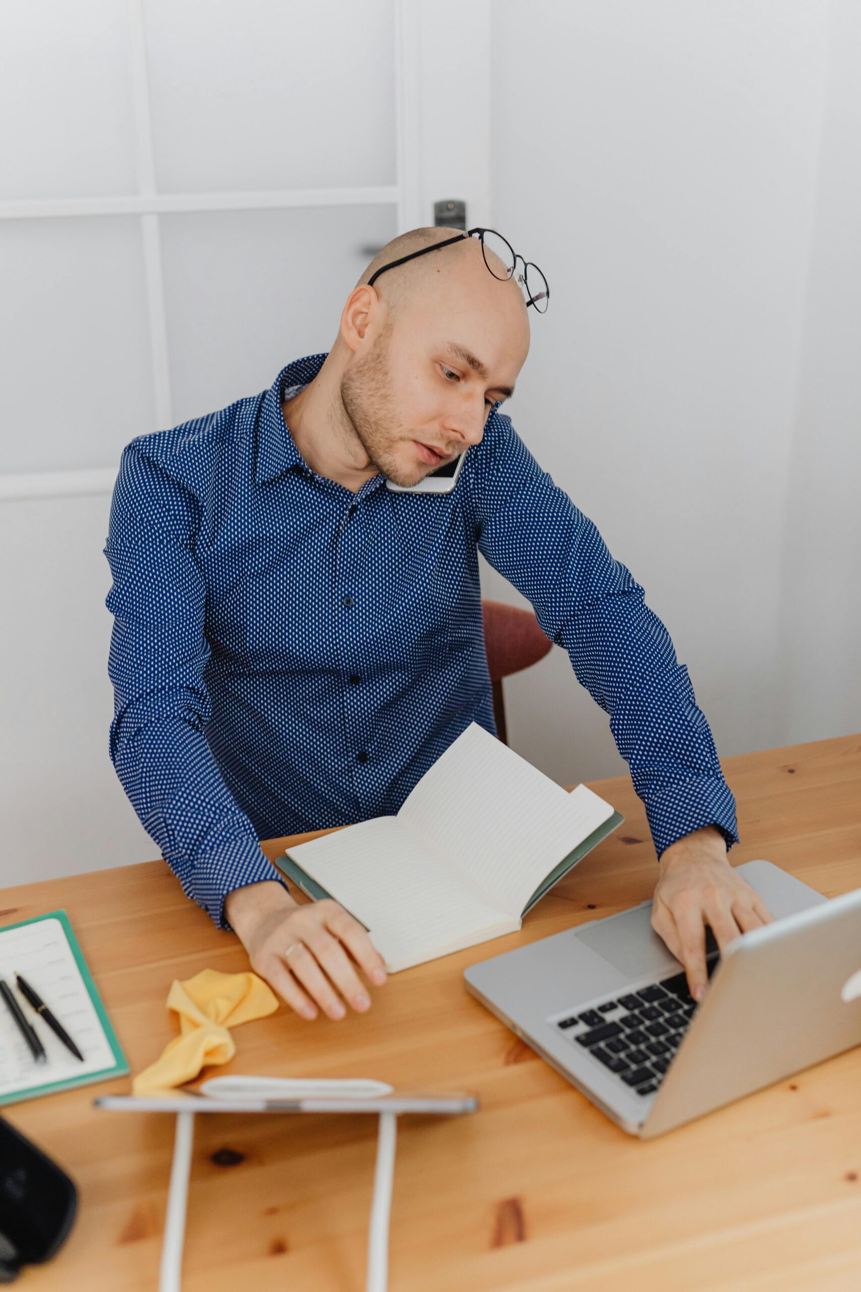 Man working remotely during outpatient rehab program while balancing addiction recovery, work responsibilities, and mental health treatment at home